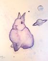 A watercolor painting of a small rabbit printed in galaxy pattern, surrounded by floating planets